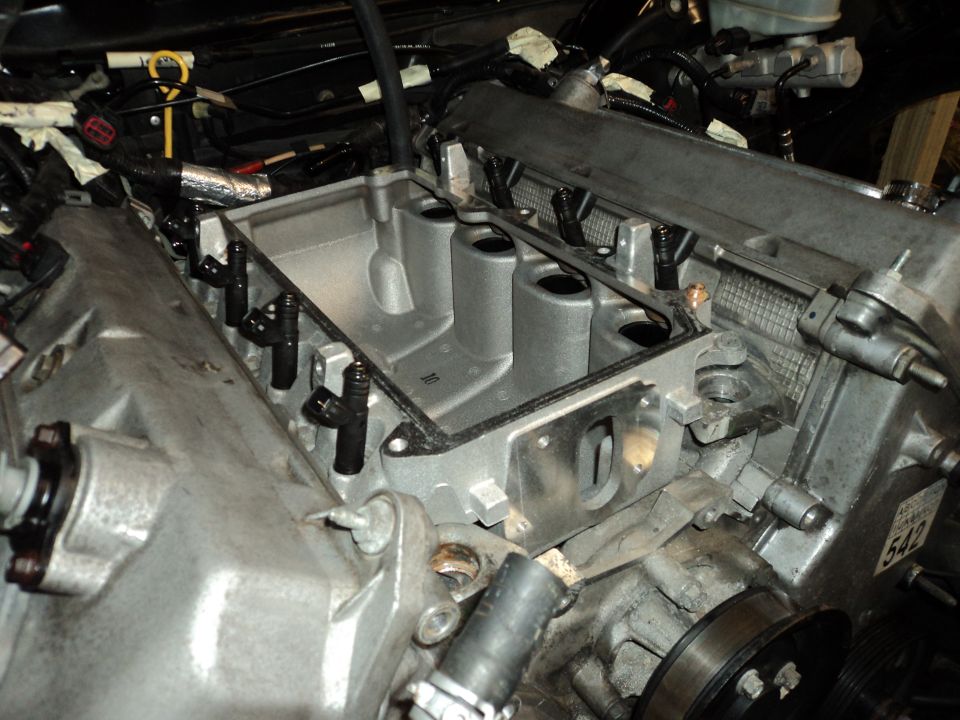 Engine intake manifold with fuel injectors installed