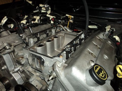 2004 Mercury Grand Marquis - Close-up view of an engine's intake manifold and fuel system during a repair or modification.