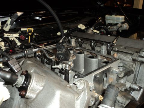 2004 Mercury Grand Marquis - Close-up of engine components, including fuel injectors and intake manifold.