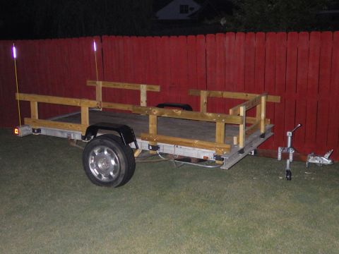 2004 Land Rover Land Rover - The stake pockets are spaced the same, so these rails fit in any position. The fiberglass reflective whips make the trailer visible behind…