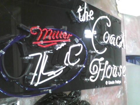 2003 Ford Crown Victoria - A neon sign displays 'Miller' in red and 'the Coach Horse' in white, with smaller text below.