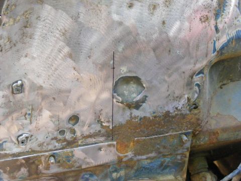1978 Ford Bronco - This image shows significant rust and damage to a vehicle's frame, indicating repair work is needed.