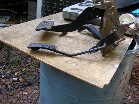 1978 Ford Bronco - A set of brake and accelerator pedals are shown, likely removed from a vehicle for repair or replacement.
