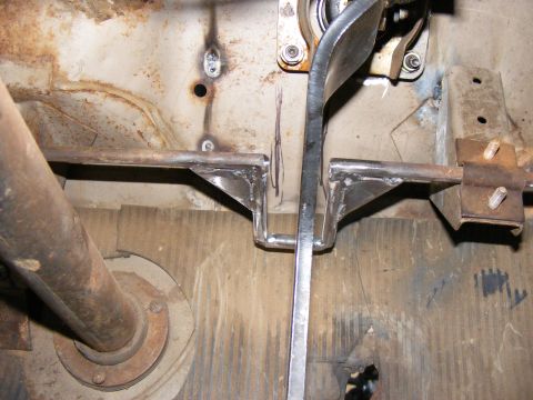 1978 Ford Bronco - Interior view of vehicle floor pan with pedals and linkage mechanism visible.