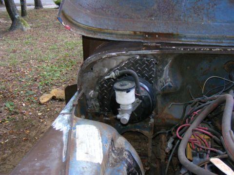 1978 Ford Bronco - The brake booster and master cylinder are visible on the firewall of a vehicle undergoing restoration.