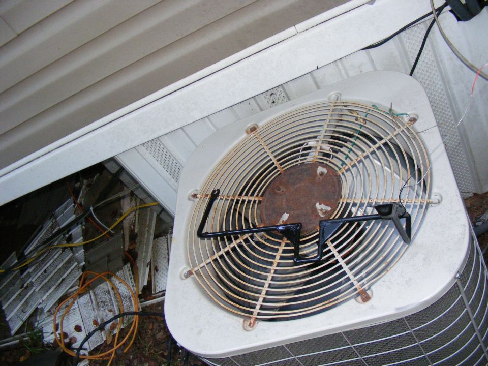 Air conditioning unit fan with Supermotors.net logo