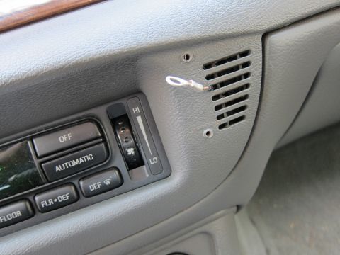 2001 Ford Crown Victoria - Dashboard climate control panel with various function buttons and a fan speed slider.