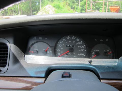 2001 Ford Crown Victoria - The dashboard of a 2001 Ford Crown Victoria displays the speedometer, fuel gauge, and temperature gauge.