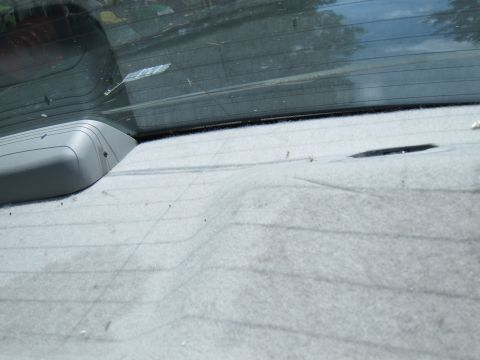 2001 Ford Crown Victoria - Interior view of the rear deck and defroster lines on the back window of a 2001 Ford Crown Victoria.