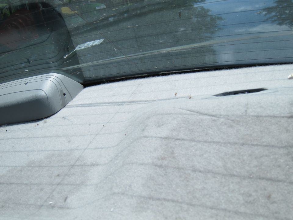 Rear interior of a 2001 Ford Crown Victoria, showing the rear deck and window