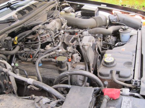 2001 Ford Crown Victoria - Engine bay of a 2001 Ford Crown Victoria, showing the V8 engine and associated components.