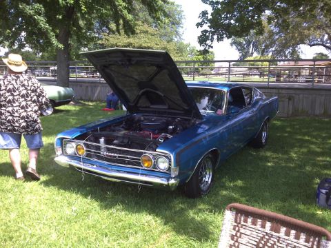 1971 Ford Ranchero - A blue coupe with its hood open sits on a grassy lawn, displaying its engine and front grille.