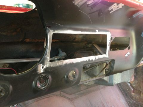 1964 Ford Fairlane - The dashboard of a car is shown with areas cut out and prepped for new paint and interior work.