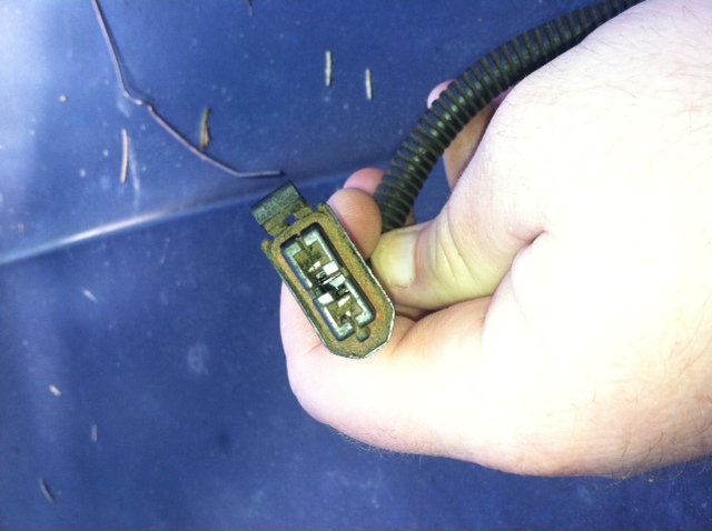You can see the wires down inside of the connector. The wires are held in place by plastic tabs (clips) down inside.