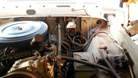 1973 Ford F-100 - Close-up view of the engine bay, showing various mechanical components and wiring.