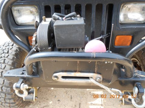 2013 Ford Bronco - Front view of a Jeep Wrangler showing a winch mounted on an aftermarket bumper.