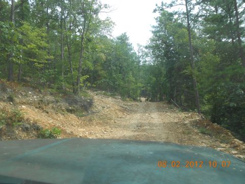 2013 Ford Bronco - Driving on a rough dirt road in a wooded area, timestamped August 2, 2012.