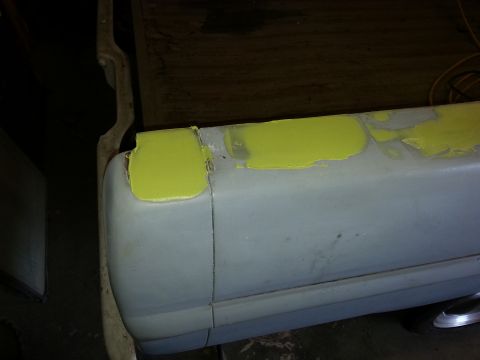 1967 Ford F-100 - This photo shows a vehicle's body panel undergoing repair with yellow primer applied to patched areas.