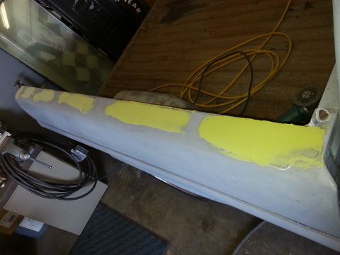 1967 Ford F-100 - Body panel undergoing repair with yellow primer applied to fill imperfections.