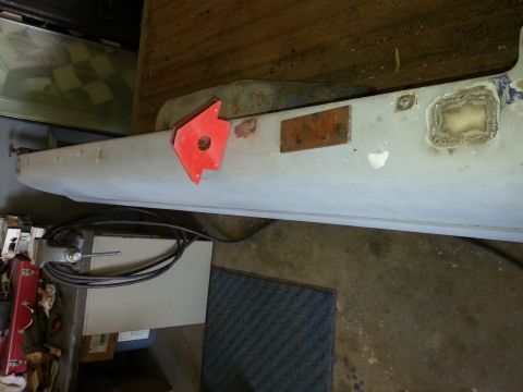 1967 Ford F-100 - A section of a truck body panel is shown with a magnetic holder and evidence of repair work.