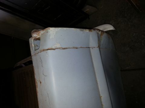 1967 Ford F-100 - Close-up of a weathered 1967 Ford F-100 fender, showing signs of rust and wear.