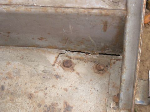 1978 Ford Bronco - Detail of corroded metal structure with visible bolts and surface damage.