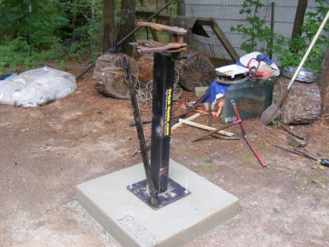 1978 Ford Bronco - Tire changing machine mounted on a concrete pad with various items in the background.