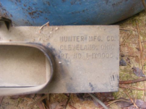 1978 Ford Bronco - A close-up shows a metal part with manufacturer and part number information stamped into its surface.
