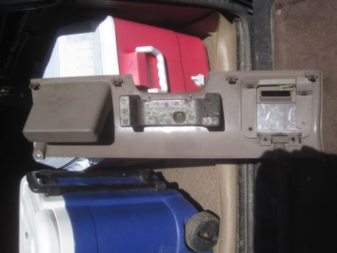 1993 Ford Bronco - Interior car panel with coolers visible in the background.