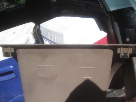1993 Ford Bronco - Interior panel detail with a cooler in the background.