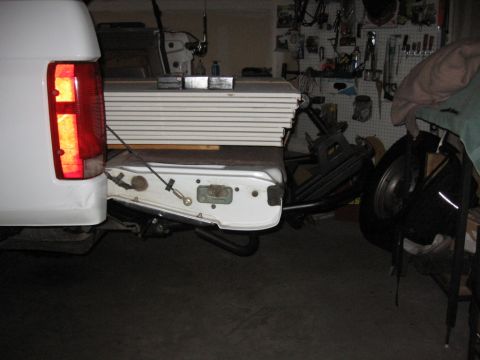 1995 Ford Bronco - Rear view of a 1995 Ford Bronco tailgate and bumper, with stacked panels in the bed.