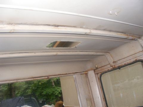 1978 Ford Bronco - Interior of a vehicle showing a damaged headliner and signs of rust.