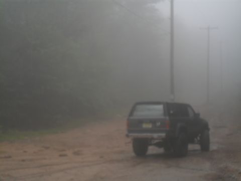 1987 Toyota 4Runner - A 1987 Toyota 4Runner is seen on a dirt road in dense fog.