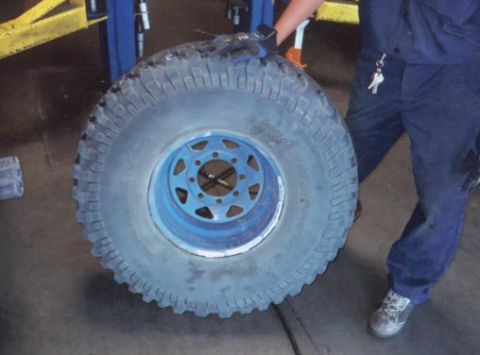 1987 Ford Bronco - front of same tire, and it still vibrates! (you think costco will let me sneek some golf balls in there?)