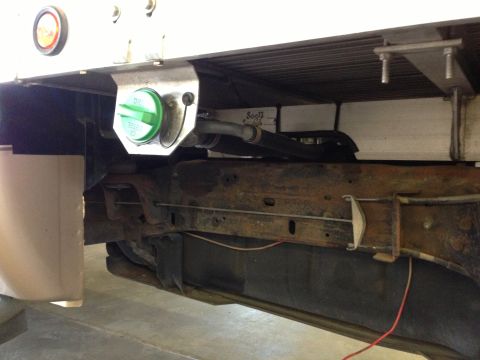1999 Ford F-250 - Underside view of a truck chassis, showing the fuel tank and filler cap.