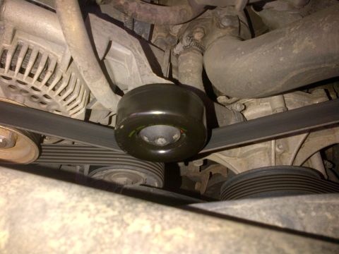 1994 Ford Bronco - Engine belt tensioner pulley and serpentine belt system detail.