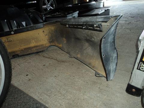 2004 Mercury Grand Marquis - This is a detached car bumper section, likely for a sedan, shown indoors.