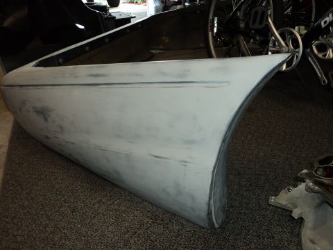 2004 Mercury Grand Marquis - A car door, possibly a Mercury Grand Marquis, is shown in primer before painting.