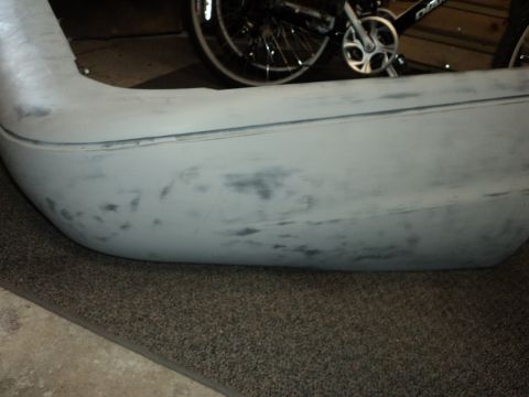 2004 Mercury Grand Marquis - This unpainted front bumper shows signs of repair and preparation for painting.