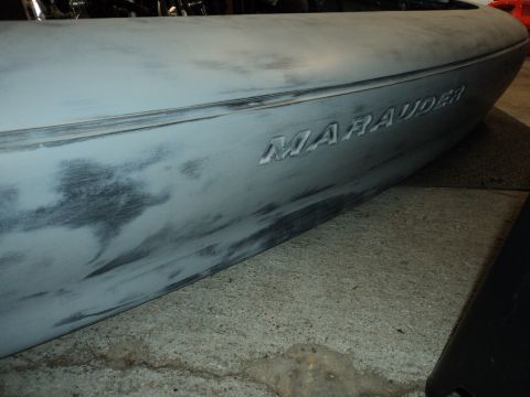 2004 Mercury Grand Marquis - The side panel of a car, possibly a Mercury Marauder, is shown with primer and sanding marks.