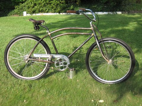 1994 Ford Bronco - Custom cruiser bicycle with a metallic brown frame and wide tires sits on a grassy lawn.