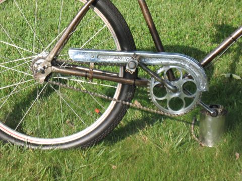 1994 Ford Bronco - The intricate mechanics of a bicycle's drivetrain are visible against a backdrop of green grass.