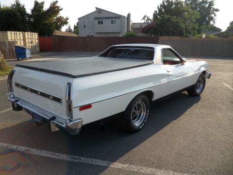 1973 Ford Ranchero - Rear view of a white 1973 Ford Ranchero with a black tonneau cover.