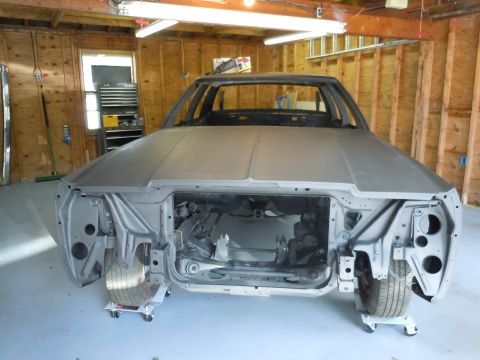 2001 Ford Crown Victoria - This 2001 Ford Crown Victoria is in a garage, stripped down for restoration, showing its front end.