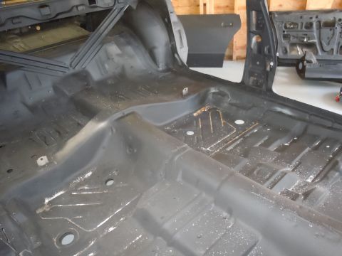 2001 Ford Crown Victoria - The interior of a car has been stripped down to its bare metal for restoration.