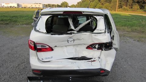 2012 Mazda Mazda 5 - 2012 Mazda Mazda 5 with significant rear damage, including a shattered rear window and compromised body panels.
