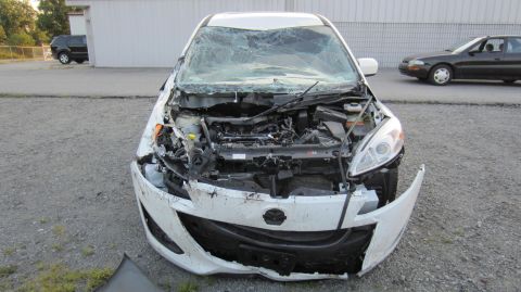 2012 Mazda Mazda 5 - This heavily damaged 2012 Mazda Mazda 5 shows extensive front-end collision damage.