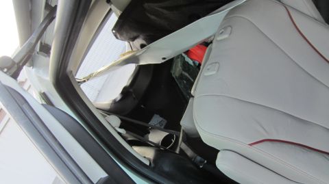 2012 Mazda Mazda 5 - Interior view of a car's passenger side, showing seats and cargo area.