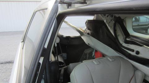 2012 Mazda Mazda 5 - The interior of a white van is shown, with seats and disassembled parts visible.