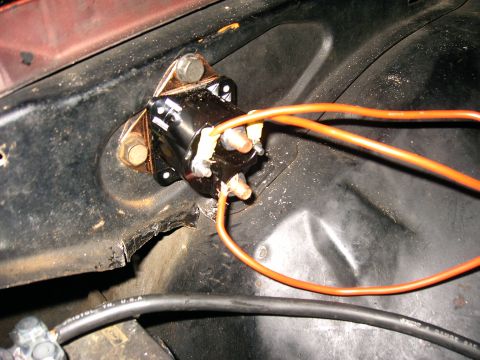 1975 Chevrolet Chevelle - A starter solenoid with connected wiring is shown in detail, mounted in a vehicle's engine bay.